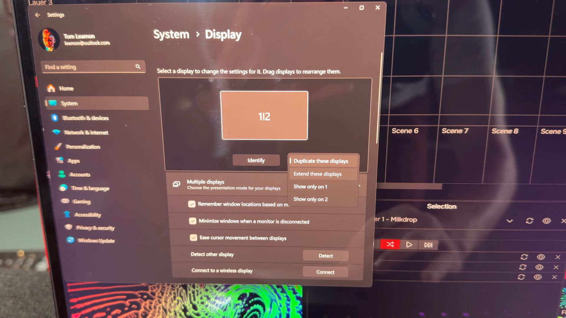 A computer screen showing the Windows display settings menu, with options to manage multiple displays and adjust display modes.